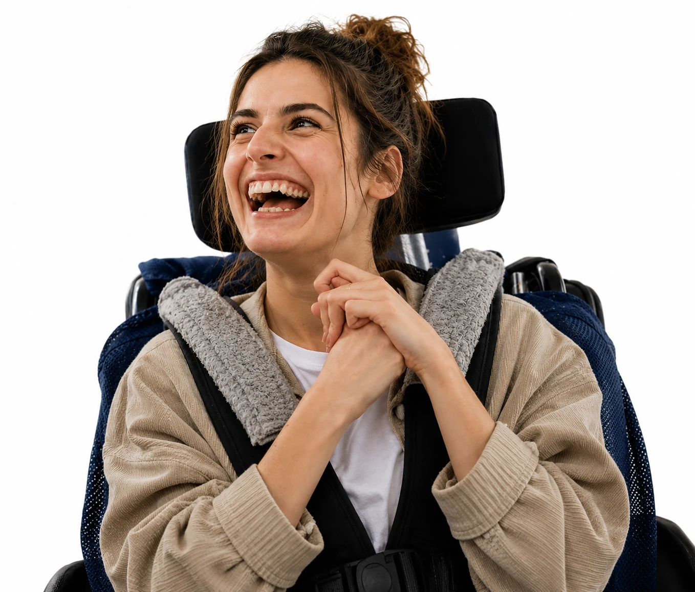 A smiling woman seated in her wheelchair, laughing
